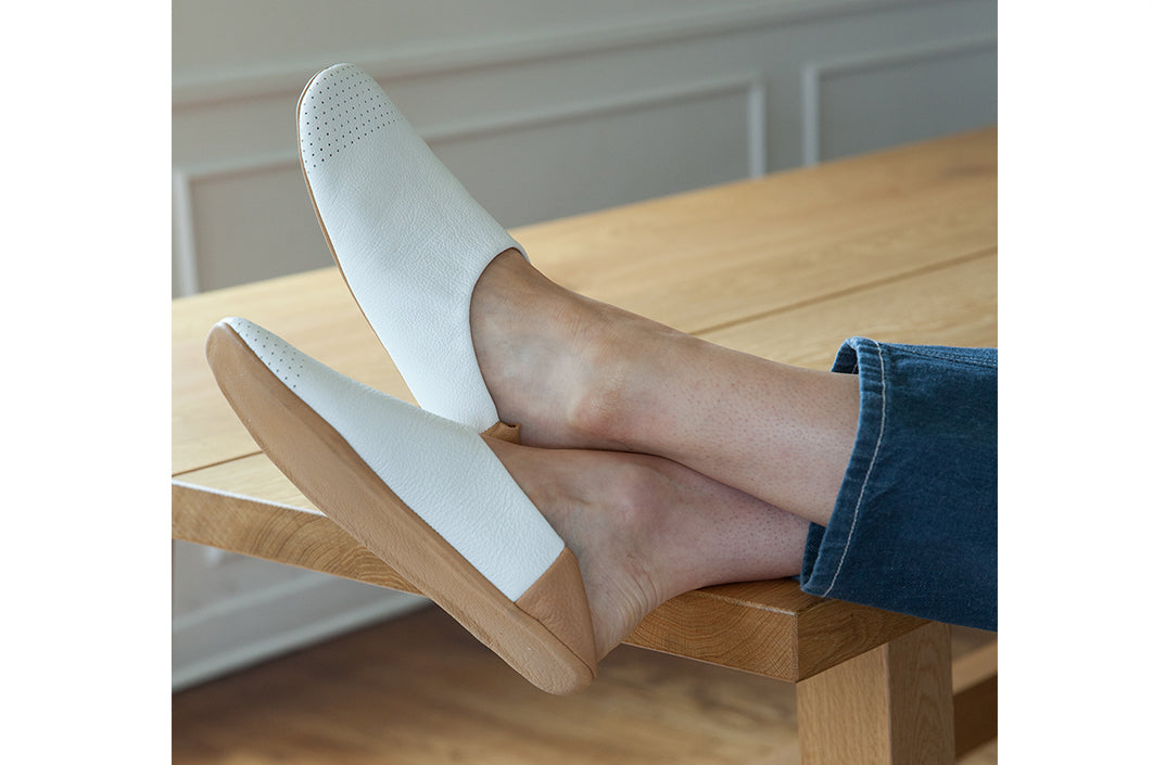 White and Tan house shoes on model