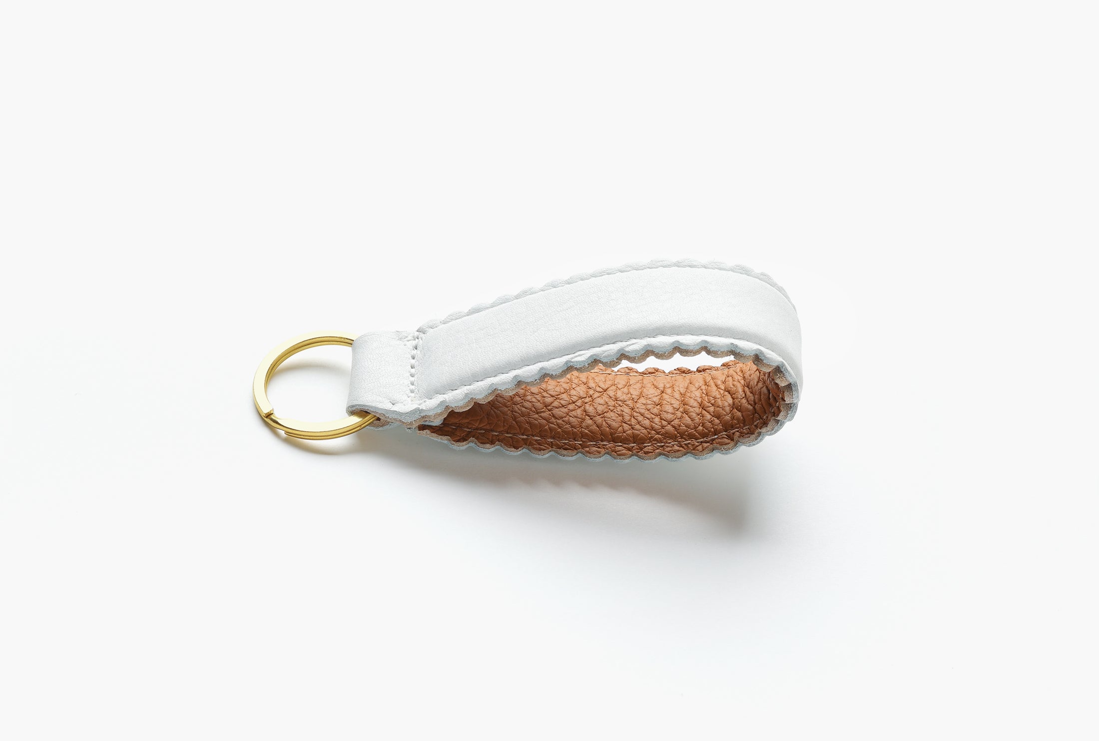 White and Tan leather keychain with brass ring